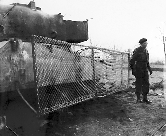 ​A mesh screen protecting the side of a Sherman tank during trials - The Tank's Hidden Foe | Warspot.net