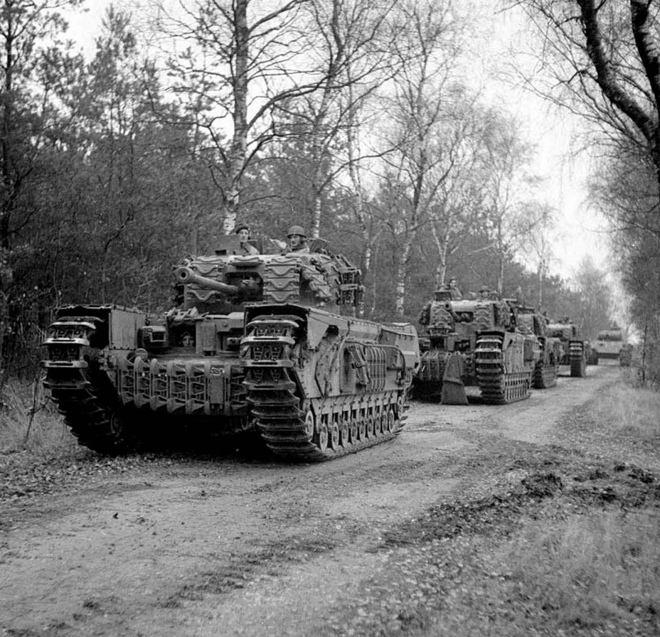 ​Churchill tanks from the 4th Coldstream Guards with Sherman tank tracks used as additional armour. This solution proved ineffective - The Tank's Hidden Foe | Warspot.net