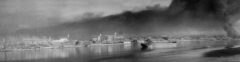 ​A view from the Soviet side (frame from August newsreels). Panorama of the Volga Bank in the area of the Salt pier, on the right are burning the oil tanks of the refinery (Neft Sindikat). Buildings in the photo: 1. Brewery 2. Complex of buildings of the NKVD 3. Mill No. 4. «House of railway workers» 5.«L-shaped house». The headquarters of the 13th Guards Rifle Division will be located in the basement of the NKVD complex, the brewery and the mill. The «House of railway workers» and «L-shaped house» will become German strongholds from the end of September to December 1942 - Unknown Stalingrad: Enemy at the Gates | Warspot.net