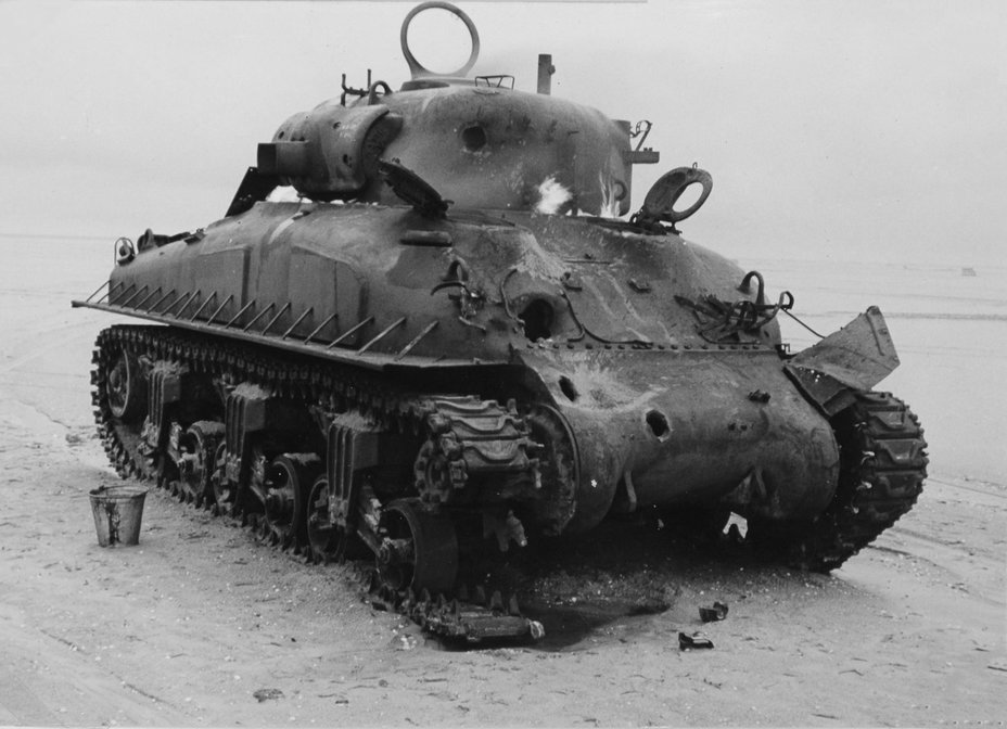 ​An M4A1E9 tank used as a shooting range target. Tanks with E9 running gear were not common. - Shermans in Mud | Warspot.net