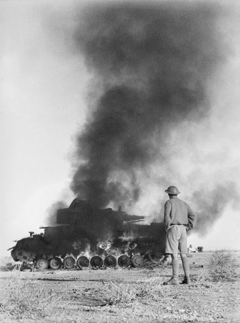 ​A British soldier watches a Pz.Kpfw.IV tank burn. Ammunition fires and detonations were a near certainty if its fighting compartment was penetrated - Second Fiddle | Warspot.net