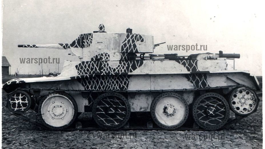 ​BT-5 tank. A portion of the vehicle is coloured in completely with white paint, and a portion is covered in white stripes on top of the base paint. The stripes are 1-3 cm wide and spaced 8-12 cm apart - Red Army's White Tanks | Warspot.net